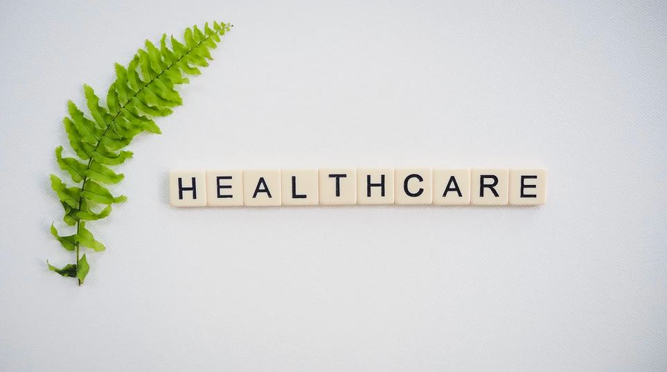 Website copywriting for clinics: This image shows scrabble pieces that spell out "healthcare".