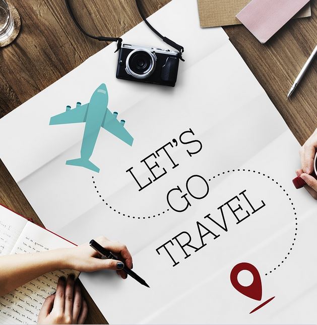 Large piece of paper with the words "Let's Go Travel" written on it