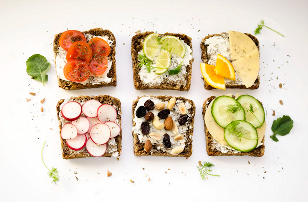 Various healthy open face sandwiches are pictured. What you eat and drink influence your energy levels.